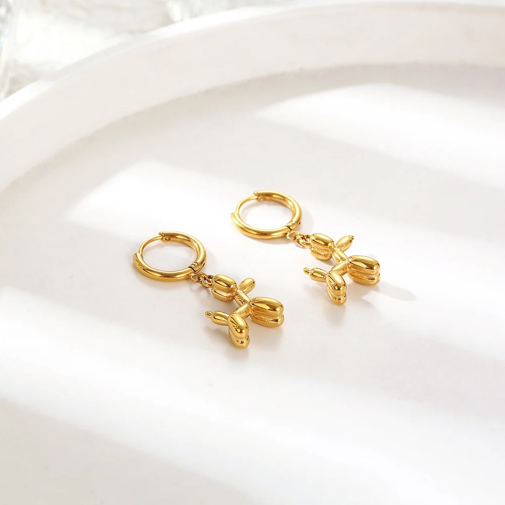 Gold Huggie Earrings with Mini Balloon Dog Charm - Image 2